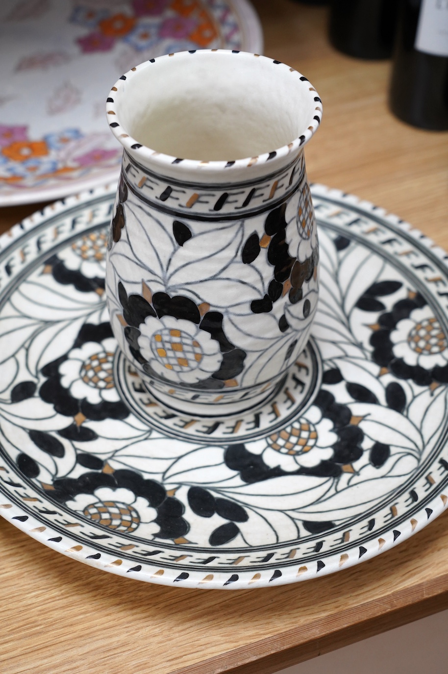 Two Charlotte Rhead signed chargers, a similar signed matching plate and vase and a ‘Mikado’ Burslem blue and white Oriental style charger designed by Frederick Rhead, largest 45cm diameter. Condition - good